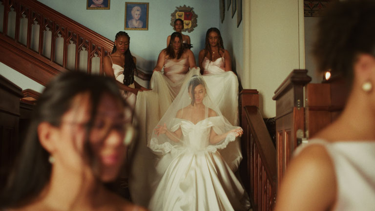 bridal exit helped by birdemaids